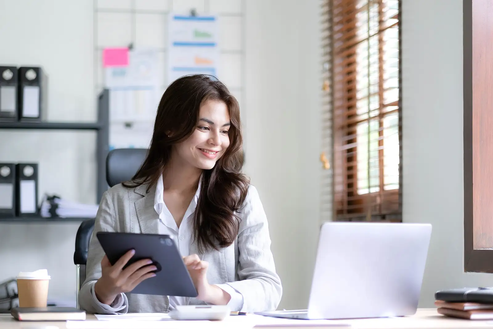 Business woman satisfied that all tax liability has been handled effectively via Reach's Merchant of Record model.